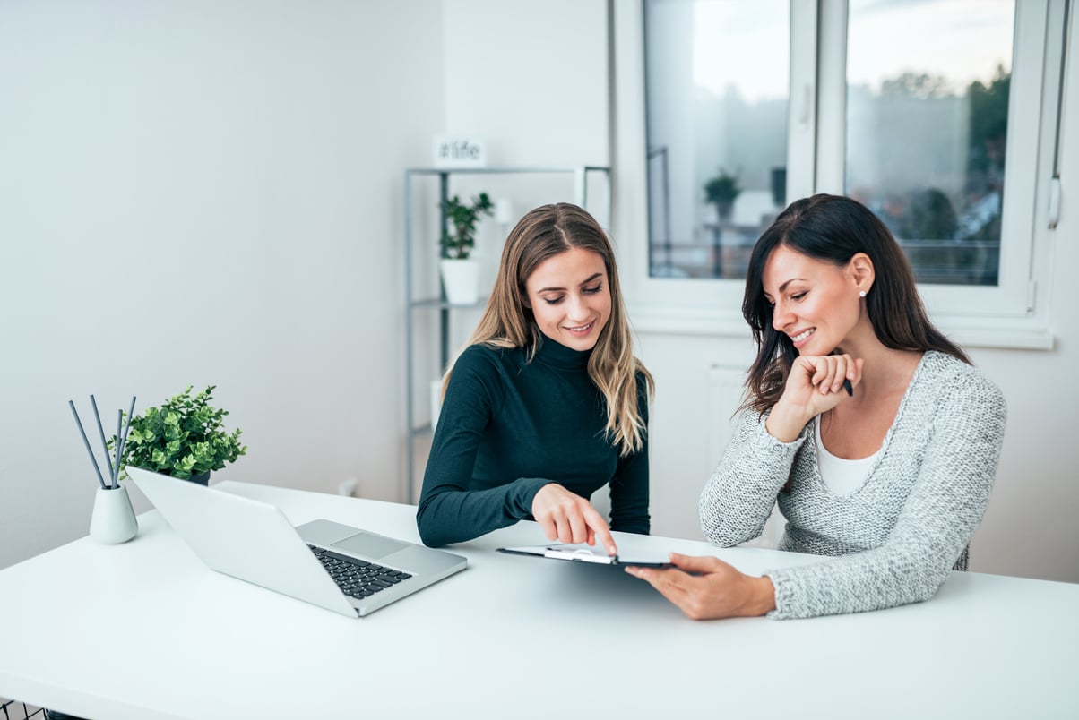 Two casual business women at work.